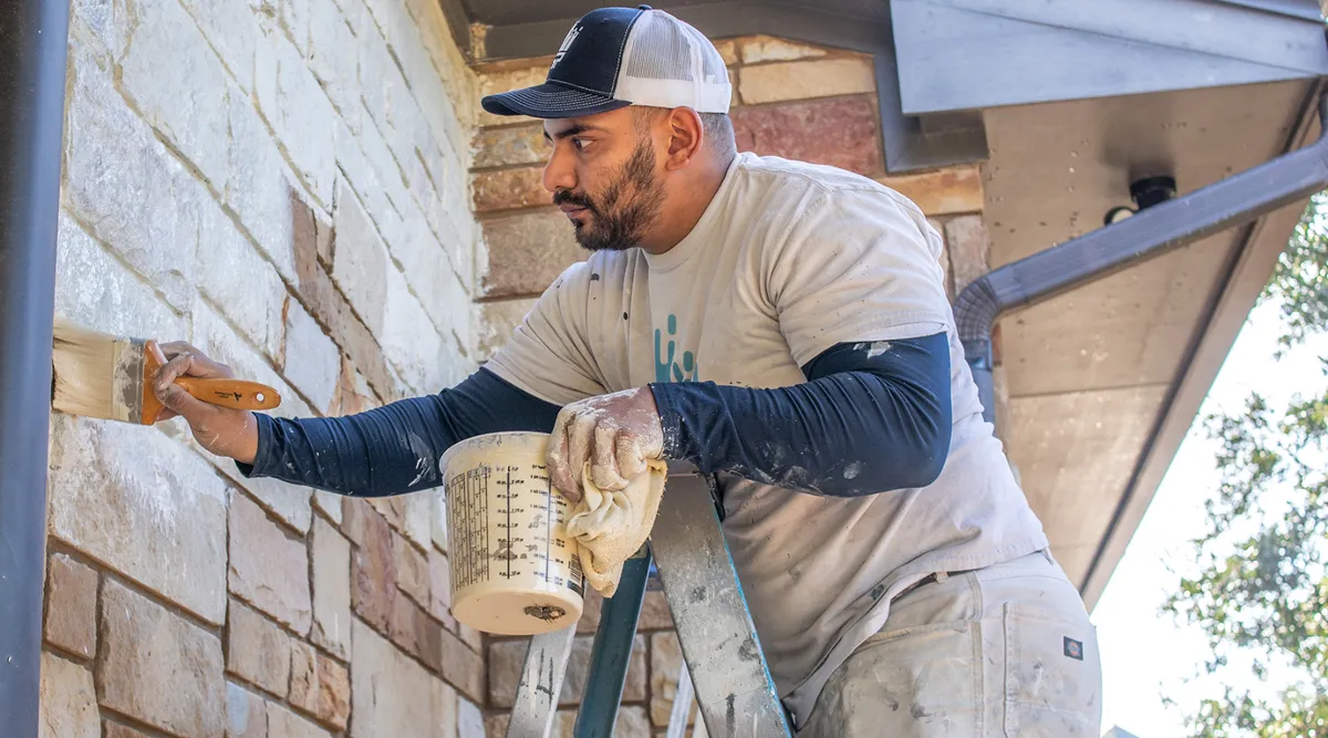 Professional brick painting service applied to home exterior