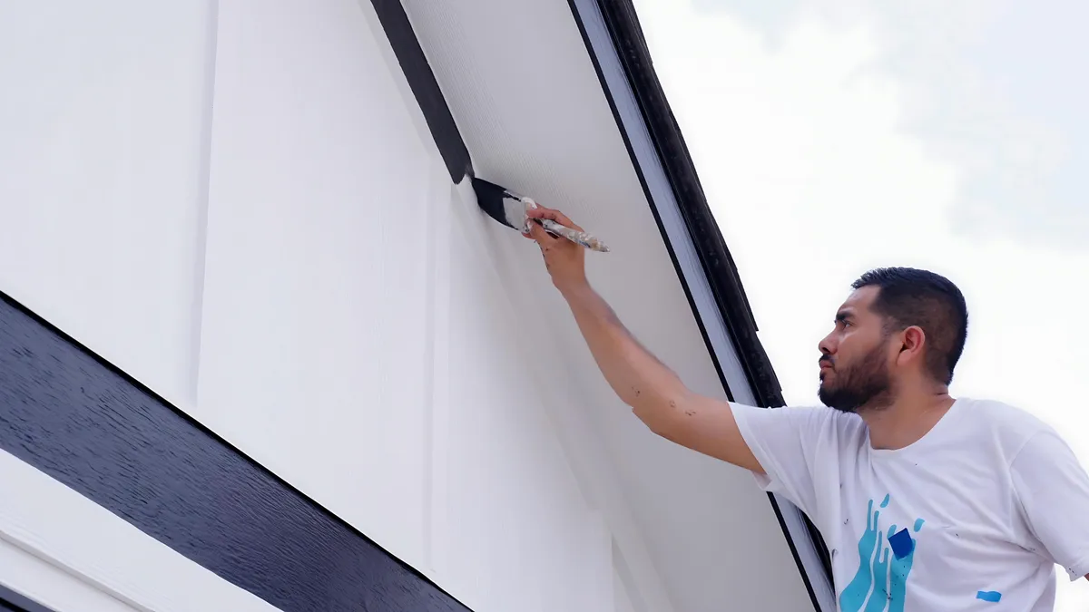 Magic Painting contractor painting exterior trim of a house in Massachusetts